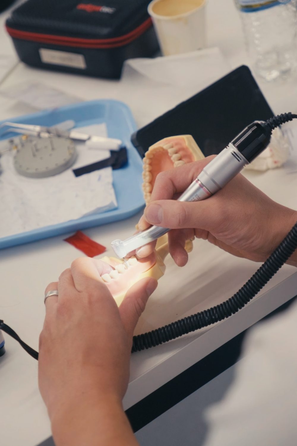 Working the occlusion by hand on a model at Exceptional Dental Academy