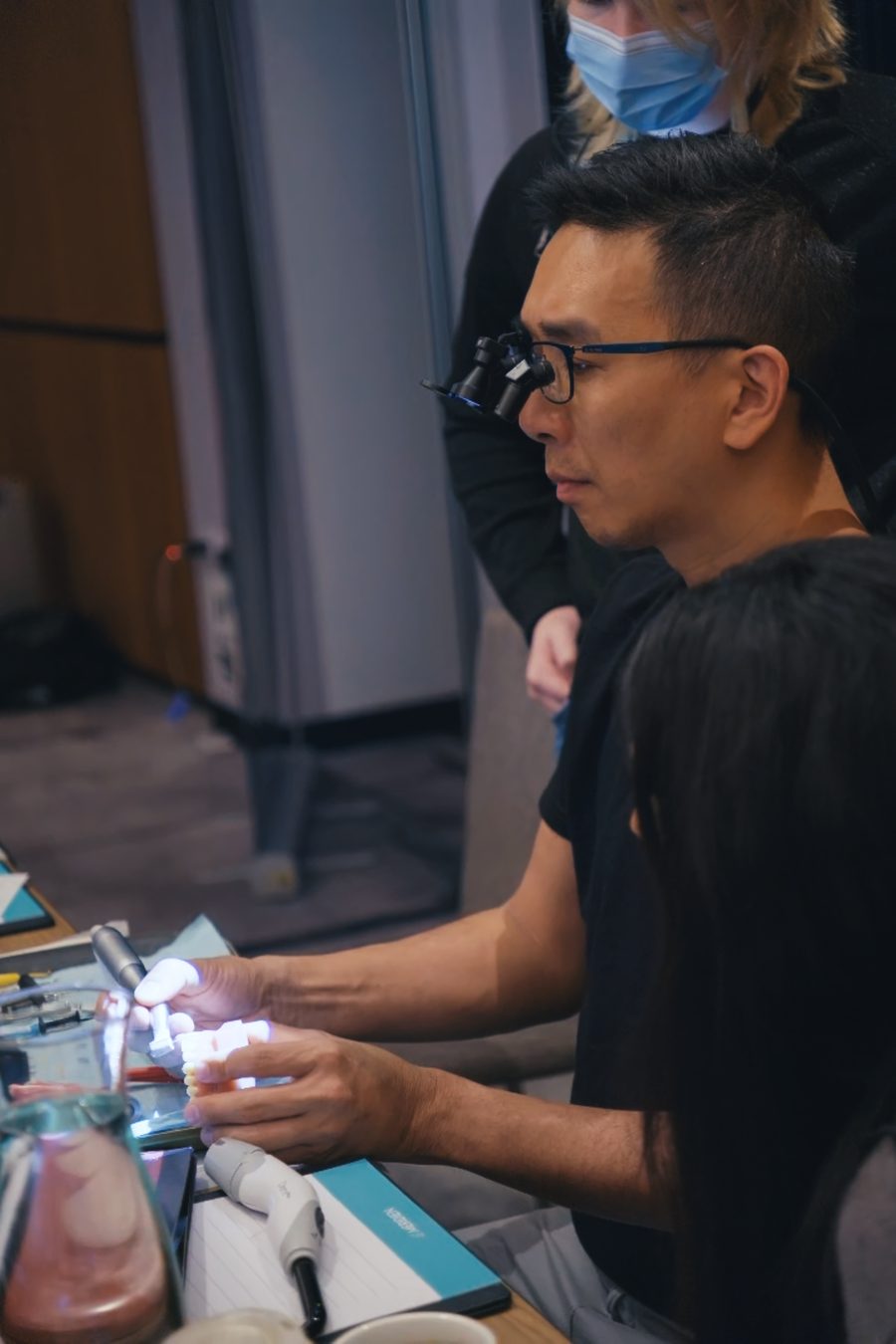 Attendee layering composite under magnification with faculty guidance